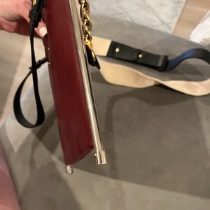 Burgundy black and with metals on the side